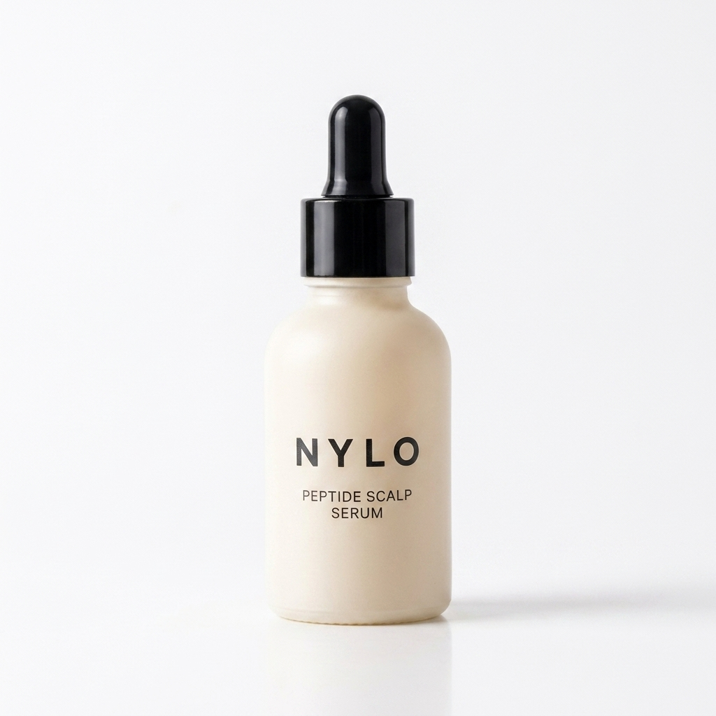 NYLO Peptide Scalp Serum - cream dropper bottle with black cap on white studio background